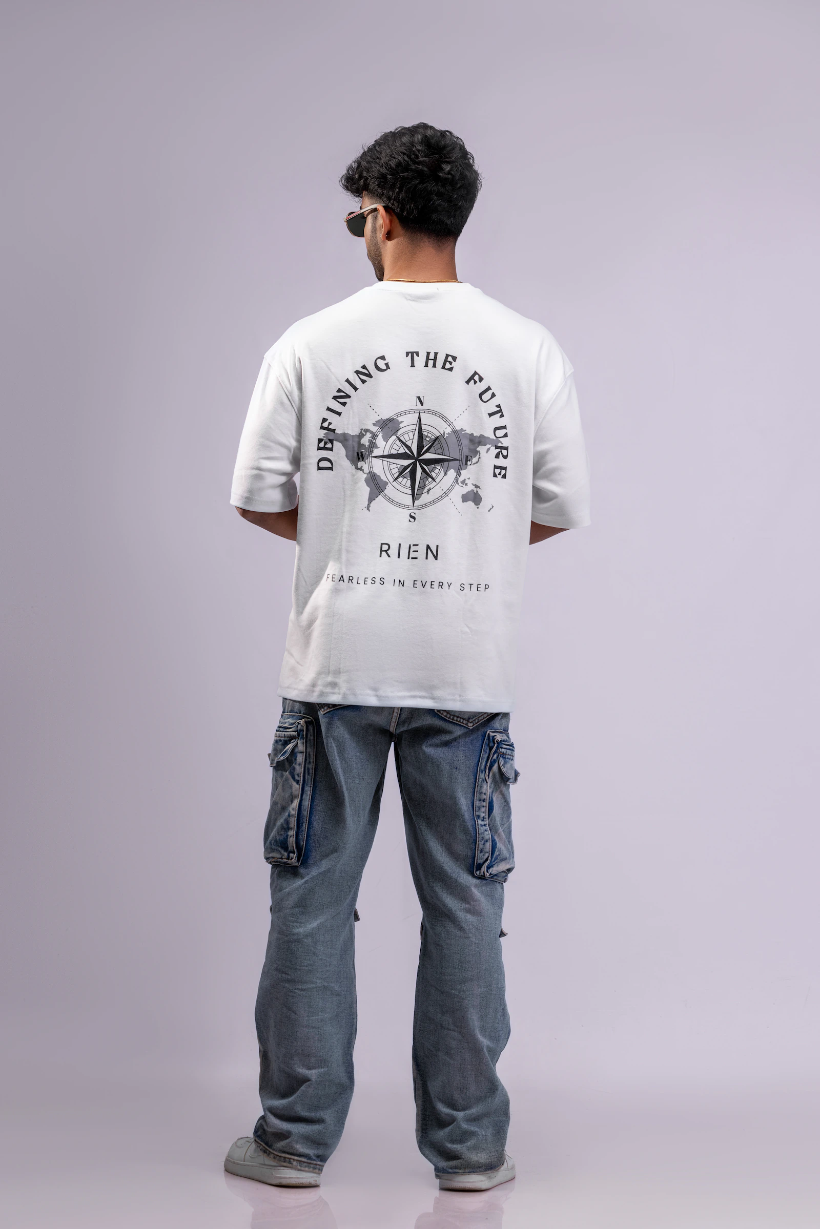Defining The Future Oversized Tee Unisex in white, back view showing the compass and world map print